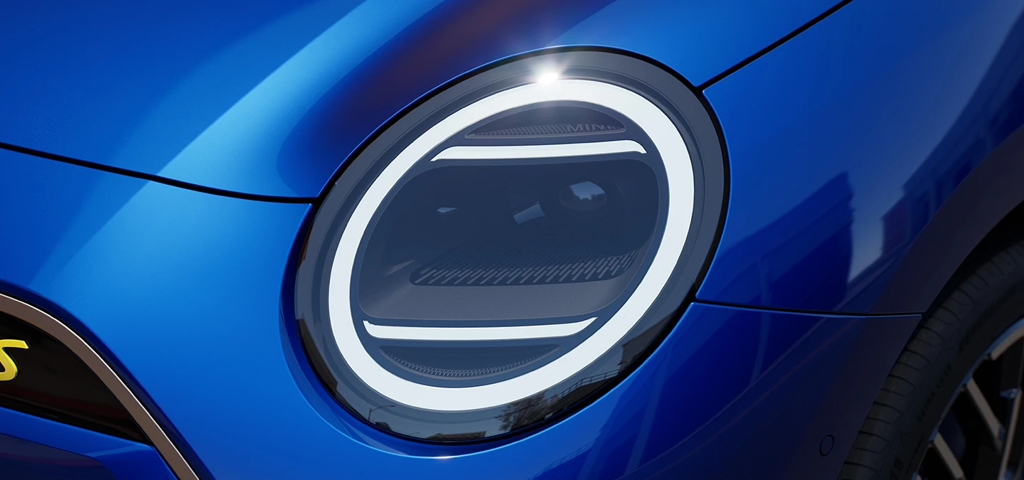 Close view of the all-electric MINI Cooper headlights with Favoured Trim.